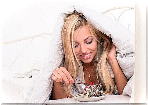 Woman eating unhealthy snacks