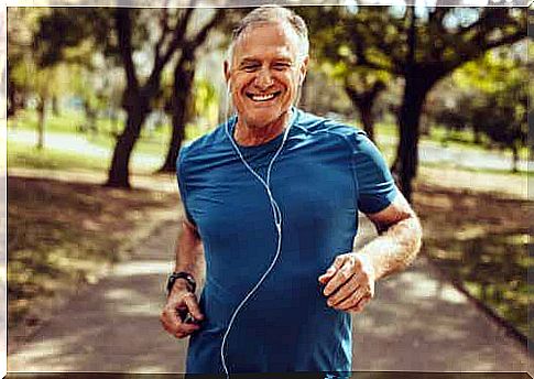 A man with earplugs running