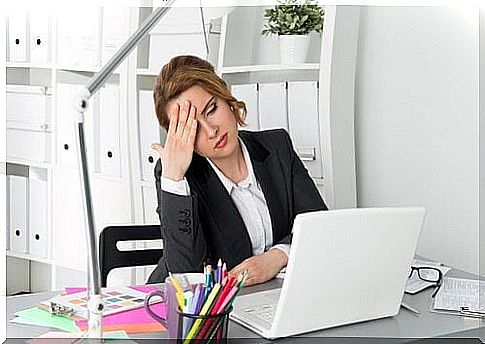 A woman who is tired in her office.