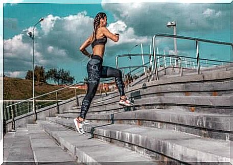 A woman running up stairs.