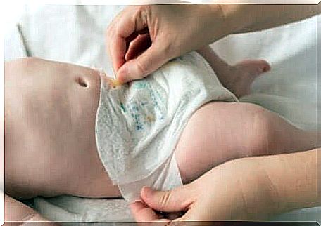 Diaper change in newborn baby