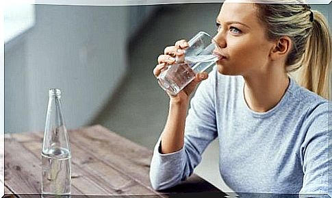 A woman drinks water