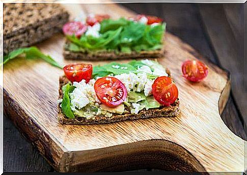 crispbread with tomato, cheese and avocado