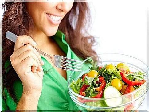 Woman eating salad