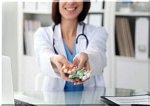 A doctor holding pills.