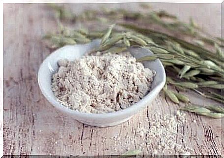 Oatmeal and colloidal oatmeal on a table.