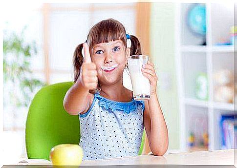 a girl drinks the type of milk that is best for children